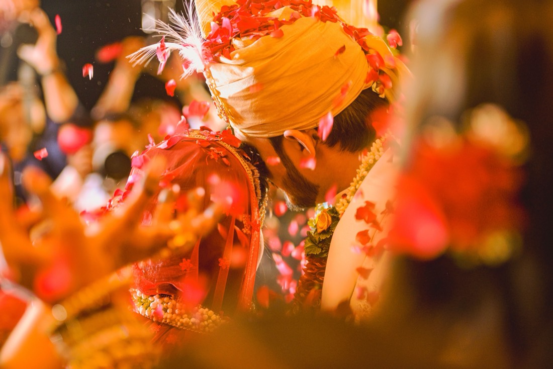 Varmala ceremony with rose petals styled by SGR Decorators